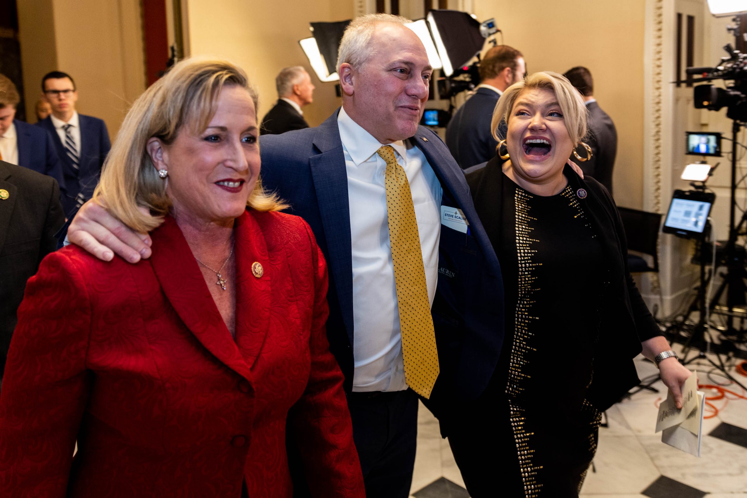 House Majority Leader Steve Scalise (R-LA) jokes with fellow Reps. Ann Wagner (R-MO) and Kat Cammack (R-FL) as they walk to the House floor to vote, on Wednesday, Jan. 11, 2023