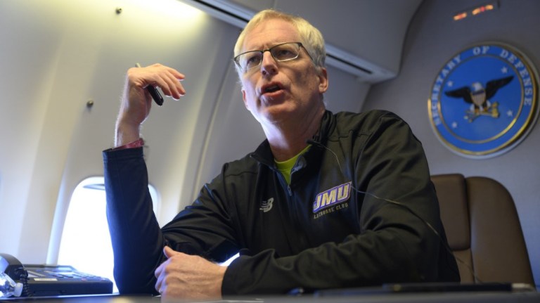 Acting Defense Secretary Chris Miller speaks to reporters on a government aircraft en route to Joint Base Andrews, Md., Jan. 14, 2021. 