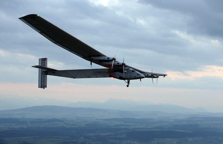 German test pilot Markus Scherdel steers the solar-powered Solar Impulse 2 aircraft for its maiden flight at its base in Payerne, Switzerland Monday,  June 2, 2014. The aircraft is the second solar plane of the Solar Impulse project. The main goal of the project is to circumnavigate the world with an aircraft, powered only by solar energy.  (AP Photo/Denis Balibouse,Pool)