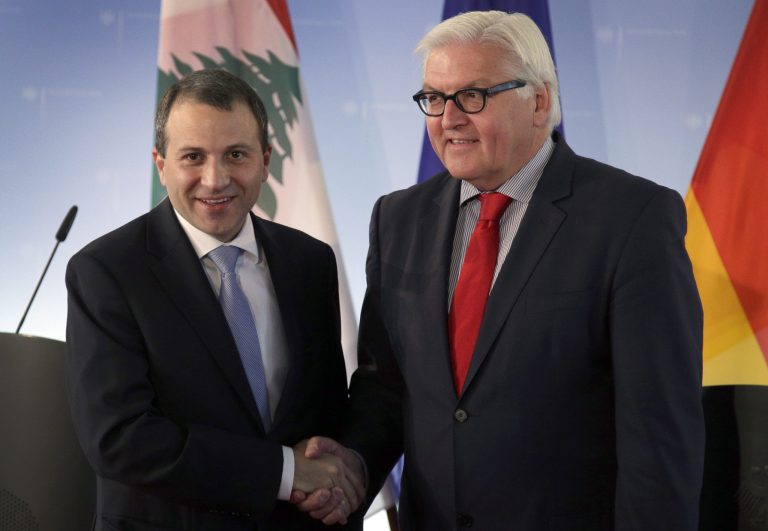Lebanese Foreign Minister Gibran Bassil, left, poses with his German counterpart Frank-Walter Steinmeier for photos after their joint news conference at the Foreign Ministry in Berlin, Germany, Tuesday, May 6, 2014. (AP Photo/Michael Sohn)