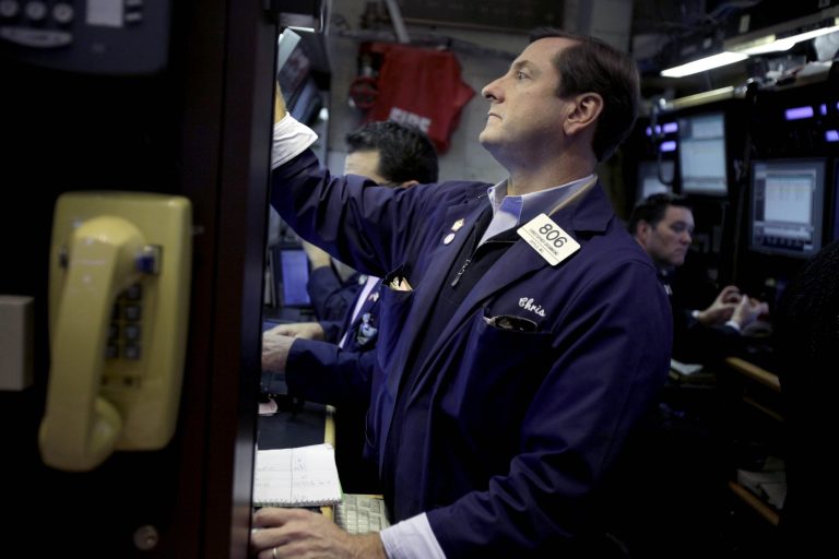   FILE - In this Nov. 15, 2012, file photo, traders work on the floor at the New York Stock Exchange, in New York. World stock markets meandered Tuesday, Dec. 4, as traders weighed a surprise drop in U.S. factory production against hopes that the U.S. will avoid the so-called fiscal cliff. (AP Photo/Seth Wenig, File)  
