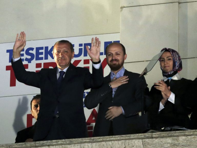 Turkey's Prime Minister Recep Tayyip Erdogan, his son Bilal Erdogan and daughter Sumeyye Erdogan salute supporters from the balcony of his ruling party headquarters in Ankara, Turkey, early Monday, March 31, 2014. Erdogan on Sunday hailed what appeared to be a clear victory for his party in local elections, providing a boost that could help him emerge from a spate of recent troubles. Erdogan was not on the ballot in the countrywide polls, but with about half of the votes counted, Turkish newswires suggested that his party was significantly outstripping its results in the last local elections in 2009 and roundly beating the main opposition party.   (AP Photo)