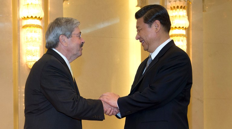 Terry Branstad must clearly say to China: Stop cheating or stealing or face real consequences. (AP Photo/Andy Wong, Pool)