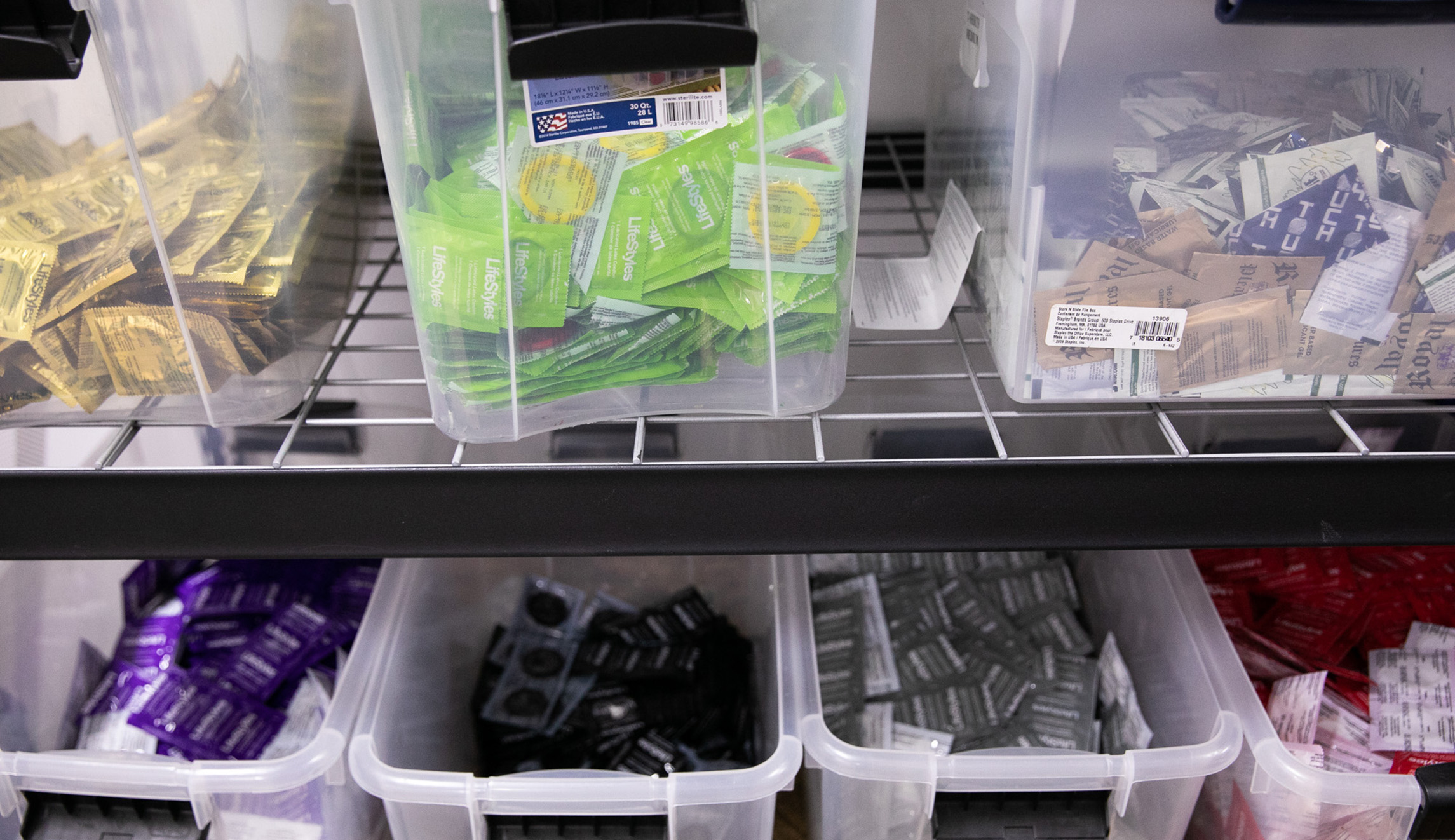 Containers filled with various condoms are shown at the D.C. office of HIPS, an anti-AIDS health and advocacy organization.