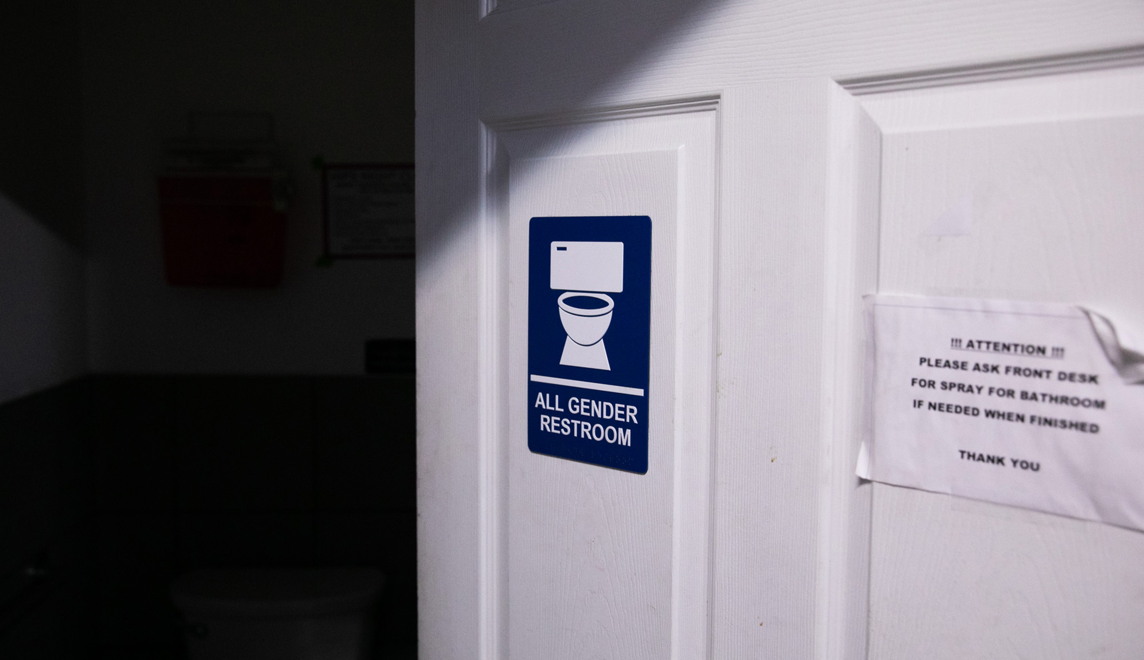 A sign indicates the presence of an all-gender restroom at HIPS' office in D.C.