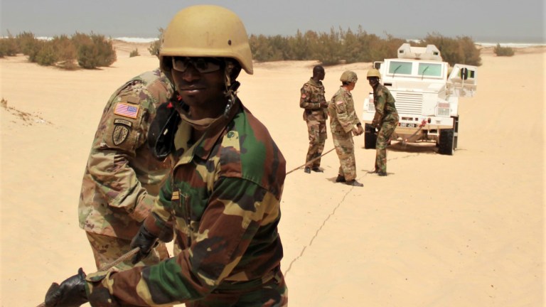 Advisers from 1st Security Force Assistance Brigade, Logistics Advisor Team 1610, train Senegalese soldiers to safely use a winch cable during vehicle recovery operations March 12, 2020, in Dakar, Senegal.