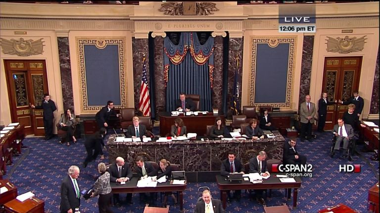   This handout video image provided by CSPAN2 shows former Senate Majority Leader Bob Dole, right, wheeled into the Senate Chamber on Capitol Hill in Washington, Tuesday, Dec. 4,2012, by his wife Elizabeth Dole. Frail and in a wheelchair, Dole was a startling presence on the Senate floor as lawmakers voted on a treaty on disabilities. The 89-year-old Republican was in the well of the Senate on the GOP side of the chamber, his wife Elizabeth nearby. Dole recently had been hospitalized but came to the Senate to push for the treaty. (AP Photo/CSPAN2)  