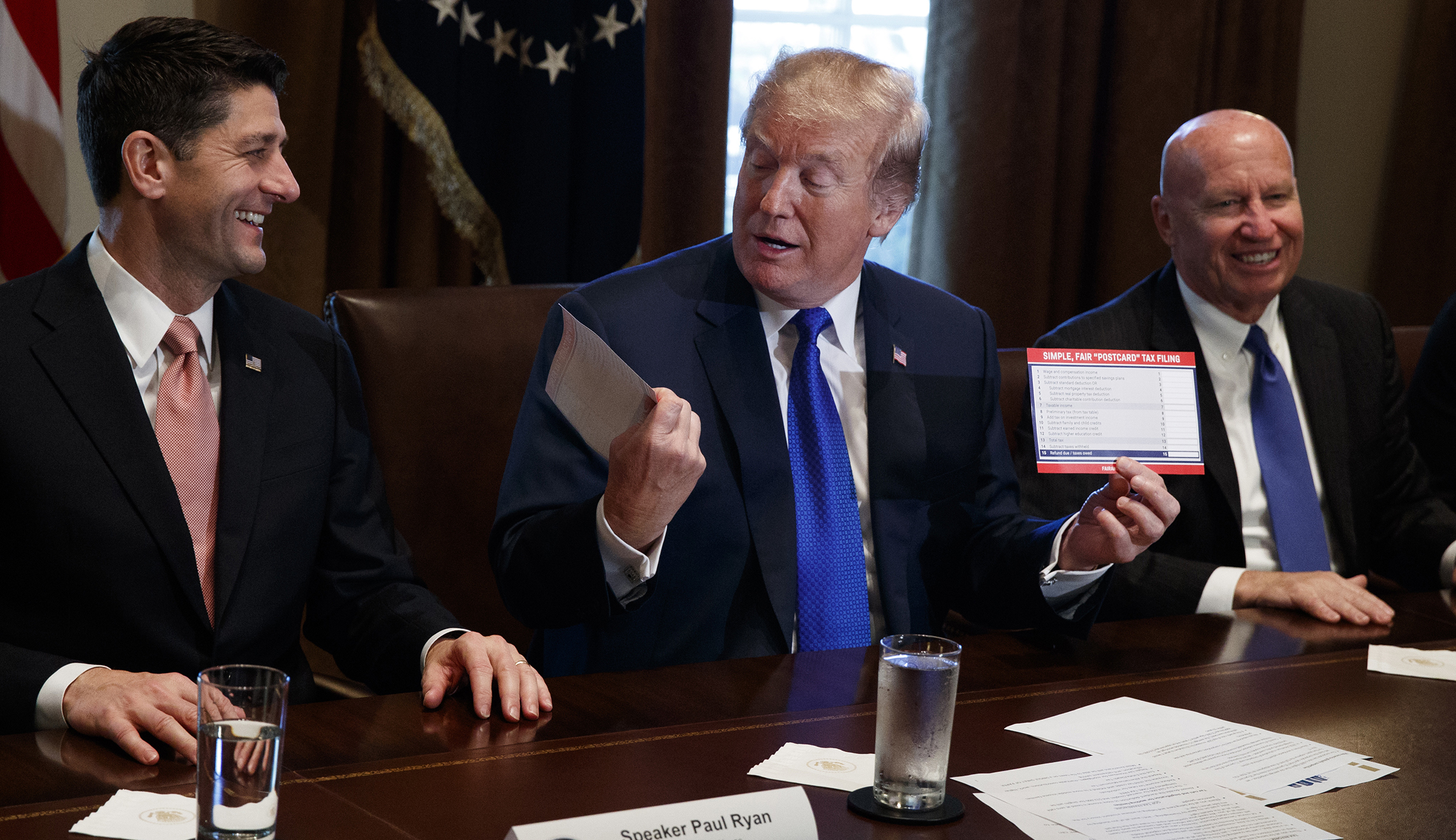 Watch: Trump kisses tax return postcard after Republicans unveil new tax reform plan