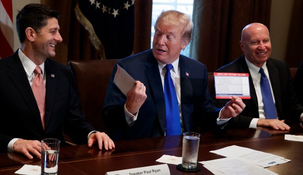 Watch: Trump kisses tax return postcard after Republicans unveil new tax reform plan