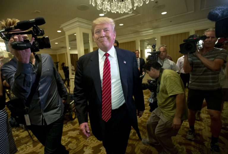 Republican presidential candidate Donald Trump smiles as he leaves after speaking at a news conference about immigration, Friday, July 10, 2015, in Beverly Hills, Calif. (AP Photo/Jae C. Hong)