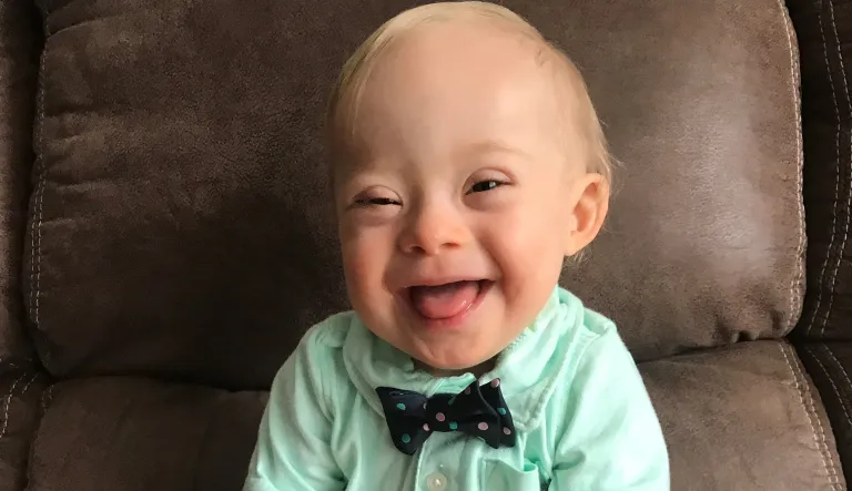 This September 2017 undated photo provided by the Warren family via Gerber shows 14-month-old Lucas Warren of Dalton, Ga. Lucas' contagious smile won over executives at Gerber baby food who have made him their 