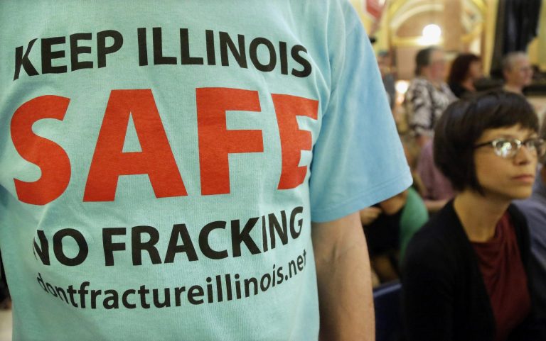 FILE - In this May 21, 2013 file photo, a protester attends a rally after a House committee hearing on 