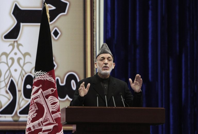 Afghan President Hamid Karzai speaks during the first day of the Loya Jirga in Kabul, Afghanistan, Thursday, Nov. 21, 2013. Karzai has told a gathering of elders that he supports signing a security deal with the United States if safety and security conditions are met. Karzai spoke as the 2,500-member national consultative council of Afghan elders known as the Loya Jirga started in Kabul on Thursday. The four-day meeting will discuss the bilateral security pact that defines the role of thousands of U.S. troops who will remain after the NATO combat mission ends in 2014. (AP Photo/Rahmat Gul)