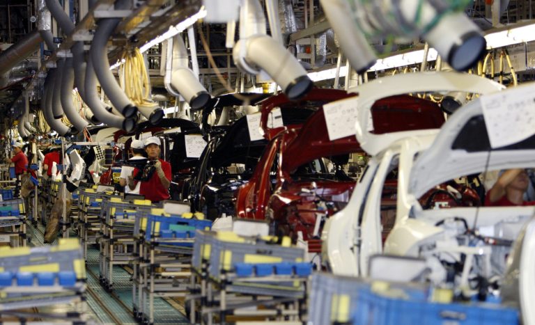   FILE - In this July 2, 2011, file photo, Nissan Motor Co. employees work on cars on the assembly line at the Japanese automaker's Oppama plant in Yokosuka near Tokyo. Nine Japanese auto parts manufacturers and two of their executives will plead guilty and pay $740 million in criminal fines for conspiring to fix the prices of more than 30 products sold to many of the world's largest automakers operating in the U.S., the Justice Department announced Thursday, Sept. 26, 2013. (AP Photo/Shuji Kajiyama)  