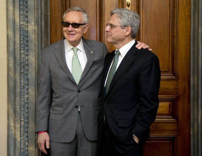 Senate Minority Leader Harry Reid, D-Nev., left, meets Supreme Court nominee Judge Merrick Garland in his office on Capitol Hill in Washington, Thursday, March 17, 2016. (AP Photo/Manuel Balce Ceneta)