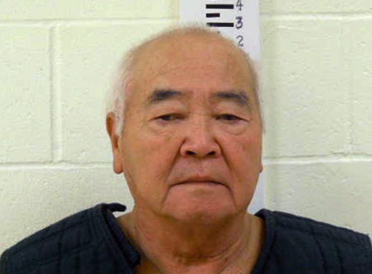   In this undated photo provided by York County Jail, James Pak, 74, of Biddeford, Maine, stands during a booking photo. Pak is to face charges Monday, Dec. 31, 2012 in the shooting deaths Saturday of two of his tenants after a possible dispute over where they parked their cars during a snowstorm, state police said. (AP Photo/York County Jail)  