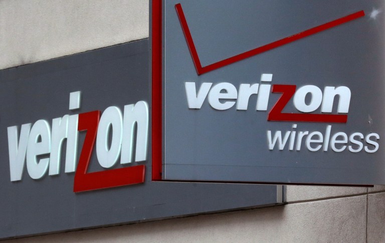 This June 4, 2014 photo shows signage at a Verizon Wireless retail store at Downtown Crossing in Boston. Verizon Wireless is launching a nationwide loyalty program this week for its 100-million-plus subscribers. There's a twist, though: To earn points for every dollar spent, subscribers must consent to have their movements tracked so the company can help target ads that match their interests. (AP Photo/Charles Krupa)