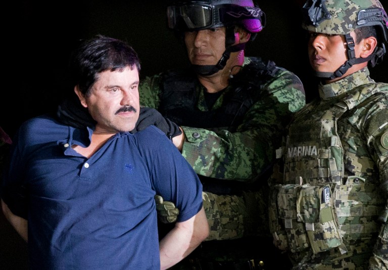 In this Jan. 8, 2016 photo, a handcuffed Joaquin 