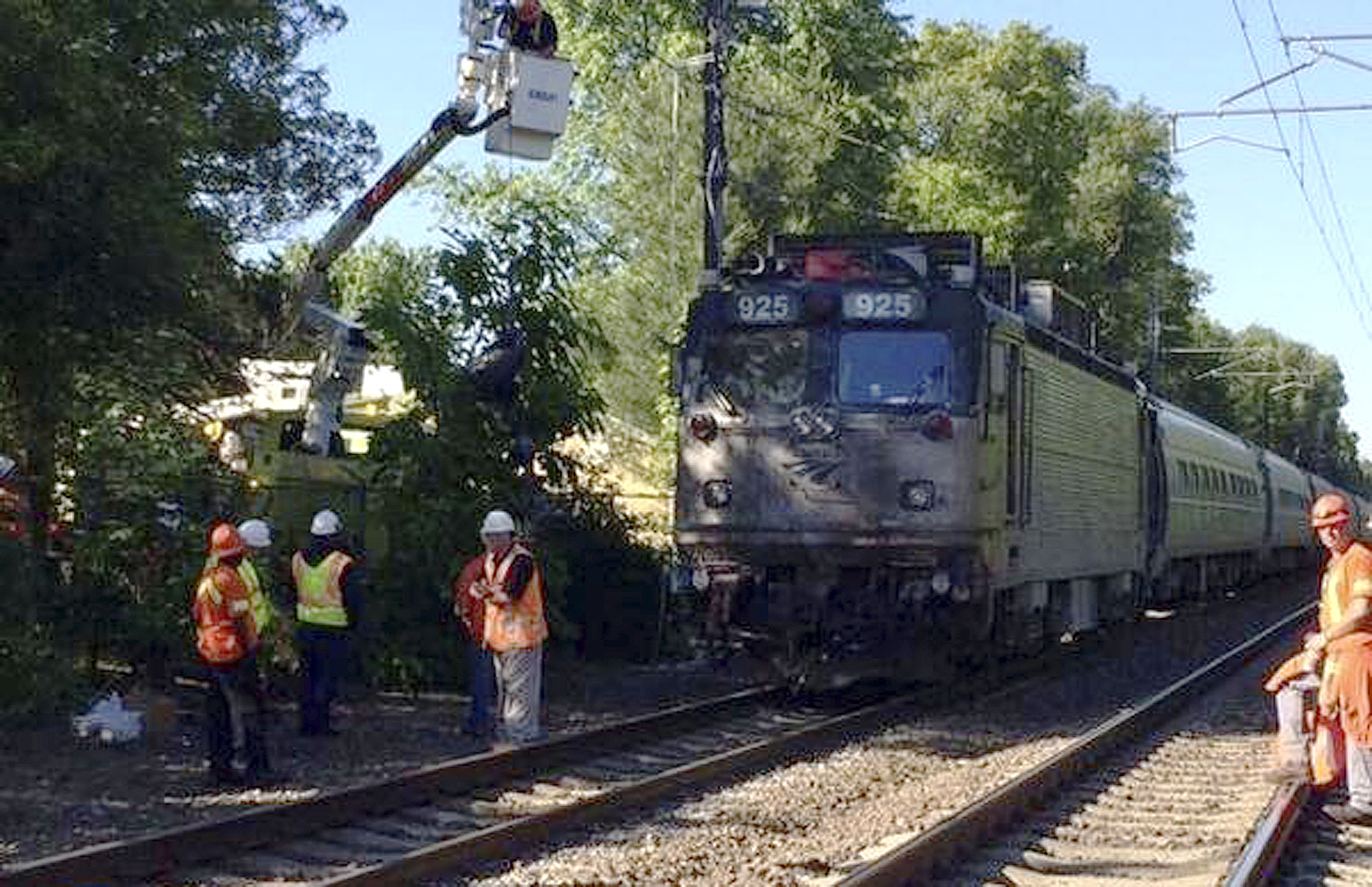 Amtrak train hits vehicle on tracks, killing 3