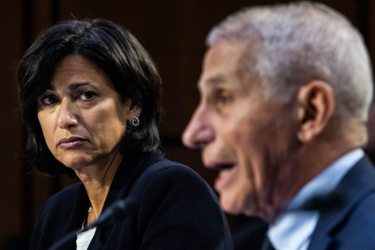 Rochelle Walensky, director of the Centers for Disease Control and Prevention, looks at Dr. Anthony Fauci, director of the National Institute of Allergy and Infectious Diseases, as he testifies during the Senate Health, Education, Labor, and Pensions Committee hearing titled 