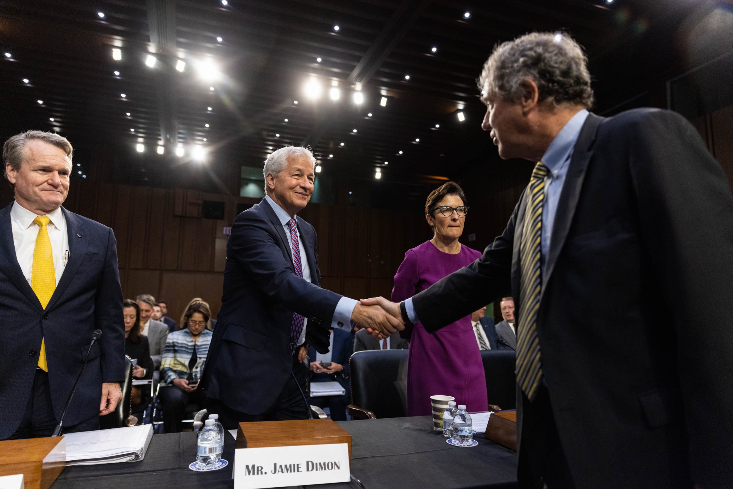 Chairman Sherrod Brown, D-Ohio, greets, from left, Brian Moynihan, CEO of Bank of America, Jamie Dimon, CEO of JPMorgan Chase, and Jane Fraser, CEO of Citigroup during a Senate Banking, Housing, and Urban Affairs Committee hearing titled "Annual Oversight of the Nation's Largest Banks," Thursday, Sept. 22, 2022.