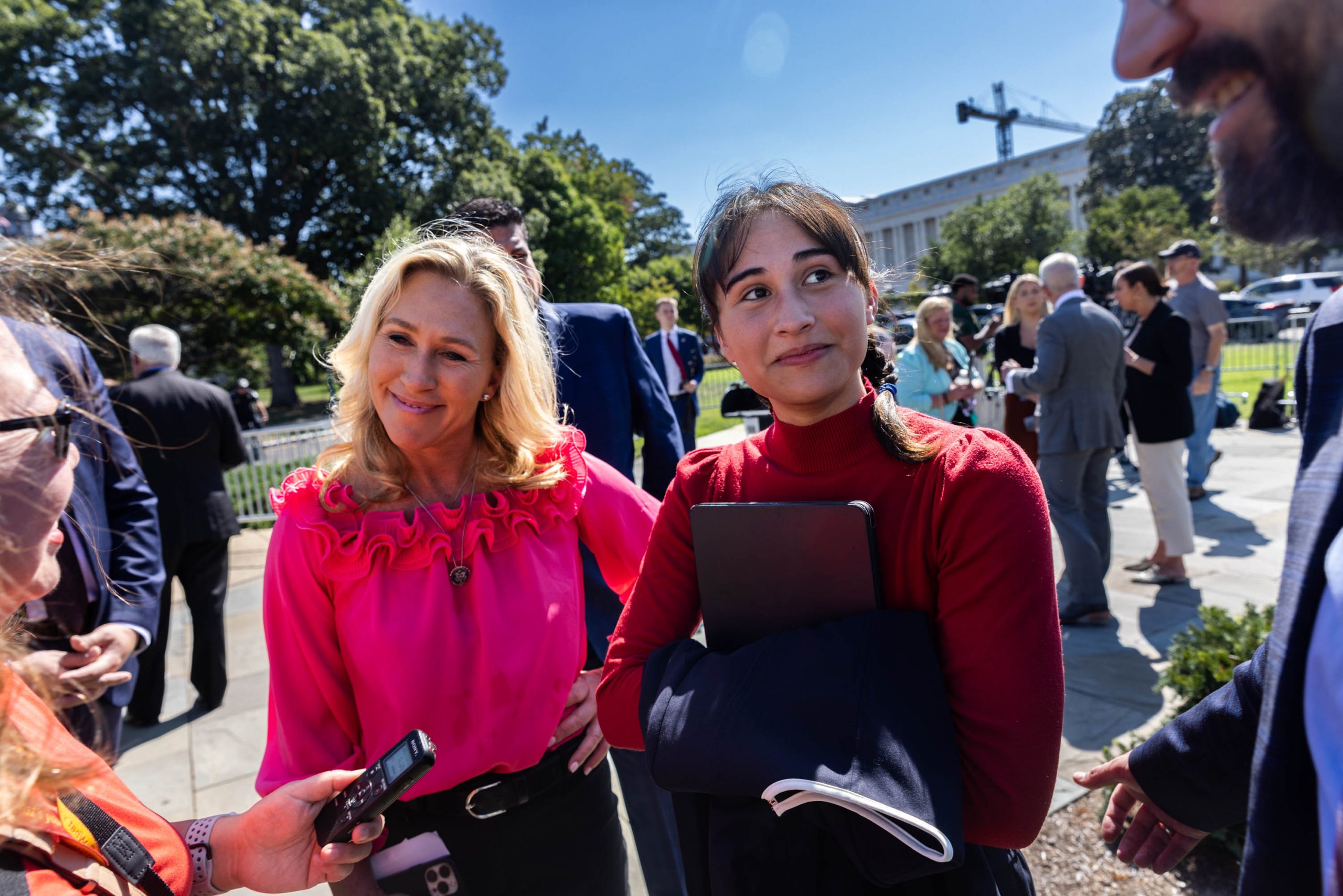 Chloe Cole, right, an ex-transgender teenager, speaks with the media following a news conference with Rep. Marjorie Taylor Greene on Capitol Hill. Greene has introduced legislation named the Protect Children's Innocence Act, which would prohibit medical intervention for transgender people under the age of 18. Tuesday, Sept. 20, 2022.
