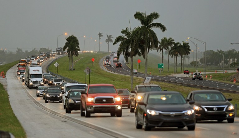 People in the Florida Keys leave town on Wednesday. Heavy rain and 185-mph winds lashed the Virgin Islands and Puerto Rico's northeast coast Wednesday as Hurricane Irma roared through Caribbean islands on its way to a possible hit on South Florida. (Al Diaz/Miami Herald via AP)