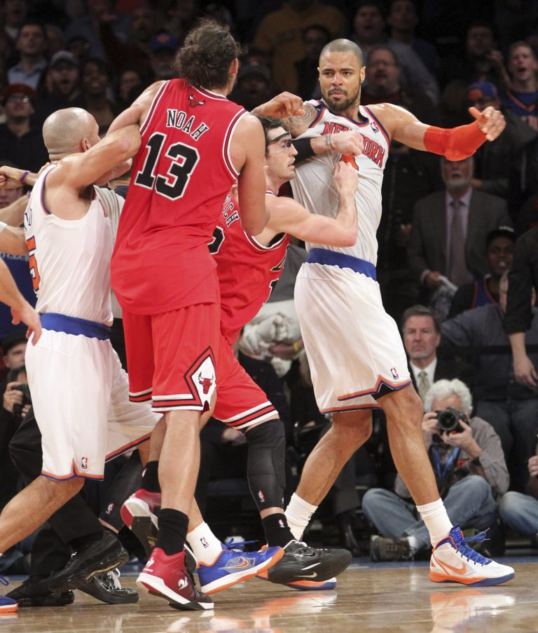   New York Knicks' Jason Kidd, left, and Chicago Bulls' Kirk Hinrich, second from right, separate Bulls' Joakim Noah (13) and Knicks' Tyson Chandler, right, during the second half of an NBA basketball game on Friday, Dec. 21, 2012, at Madison Square Garden in New York. The Bulls defeated the Knicks 110-96. (AP Photo/Mary Altaffer)  