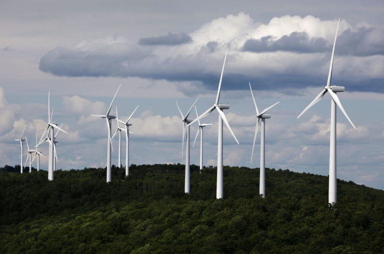   FILE - In this July 14, 2009 file photo, a cluster of windmills catch the wind blowing on Stetson Mountain, in Range 8, Township 3, Maine. A group of wind power executives, meeting in Atlanta, says a stalled effort to renew federal tax credits for the industry is creating instability and financial concerns. Meanwhile, presidential aides Karl Rove and Robert Gibbs spoke with executives at their annual conference about bipartisan support for the tax credits but a tough political climate between now and the November presidential election. (AP Photo/Robert F. Bukaty, files)  