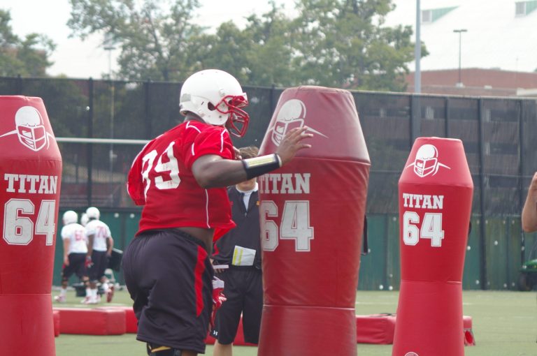  Maryland freshman Quinton Jefferson takes it out on a tackling dummy in Tuesday's practice. / Photo by Kevin Dunleavy 