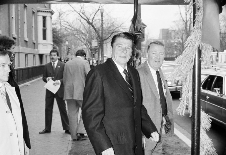 President elect Ronald Reagan and his transition team leader Edwin Meese leave the Blair House in Washington December 10, 1980, en route to the Republican National Headquarters for a meeting with Bill Brook, chairman of the Republican National Committee. (AP Photo/Charles Tasnadi)