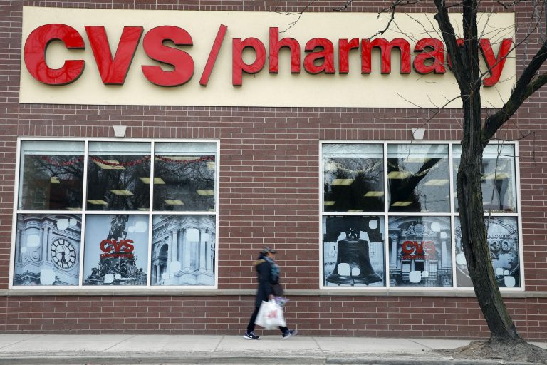 A pedestrian passes a a CVS store in Philadelphia.