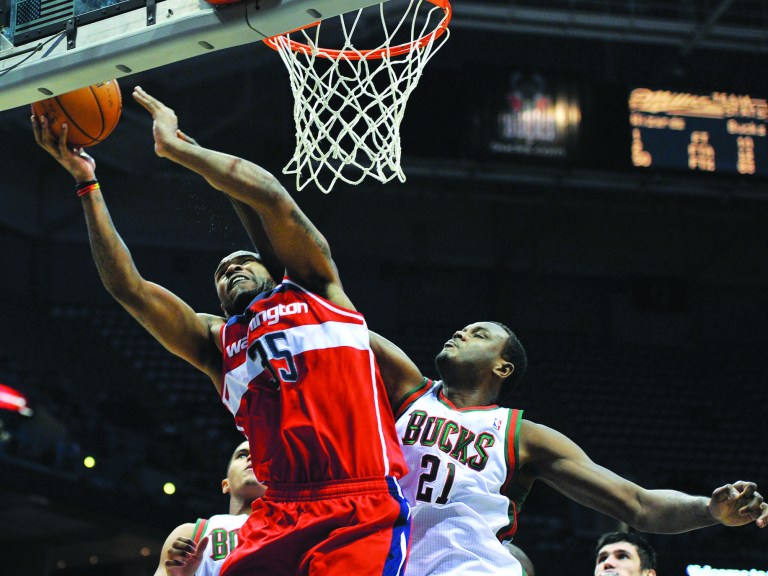 Jim Prisching/AP
With John Wall and Nene out, forward Trevor Booker is part of a rotation of players who could play heavy minutes to start the season.