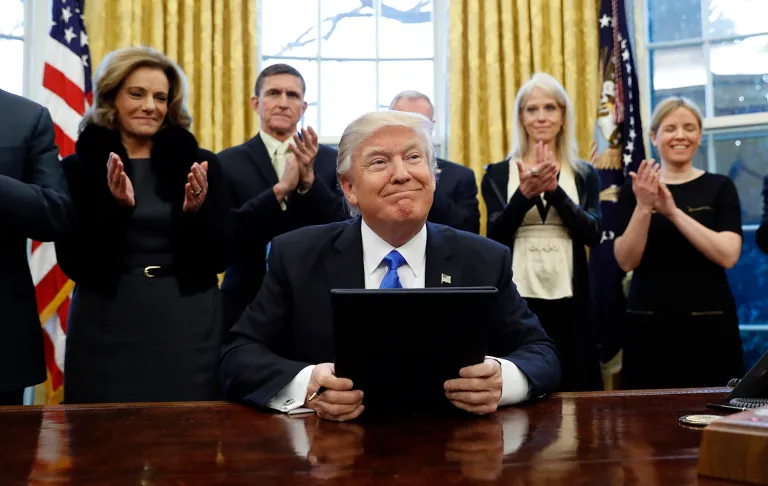 President Donald Trump smiles after signing three executive actions in the Oval Office, Saturday, Jan. 28, 2017 in Washington. (AP Photo/Alex Brandon)