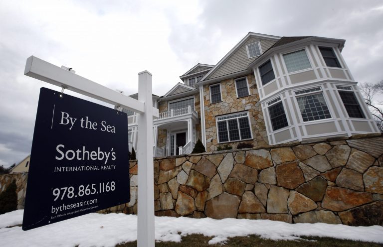This March 21, 2014 photo shows a home for sale in North Andover, Mass. Freddie Mac, the mortgage company, releases weekly mortgage rates on Thursday, April 24, 2014. (AP Photo/Elise Amendola)