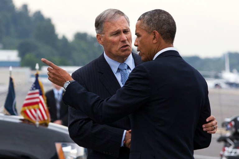 Washington Gov. Jay Inslee greets President Obama as he arrives in Seattle Tuesday, July 22, 2014, at the start of a three-day West Coast trip that is planned to include at least five fundraising events in Seattle, San Francisco and Los Angeles. (AP Photo)