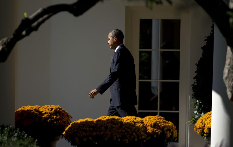 President Barack Obama walks out of the Oval Office of the White House in Washington, Friday, Oct. 25, 2013, before boarding the Marine One helicopter for a short trip to Andrews Air Force Base, Md., before traveling to New York for a visit to Pathways in Technology Early College High School, or P-TECH, in Crown Heights neighborhood of Brooklyn. He will also attend a Democratic fundraiser before return to Washington later in the evening. (AP Photo/Pablo Martinez Monsivais)