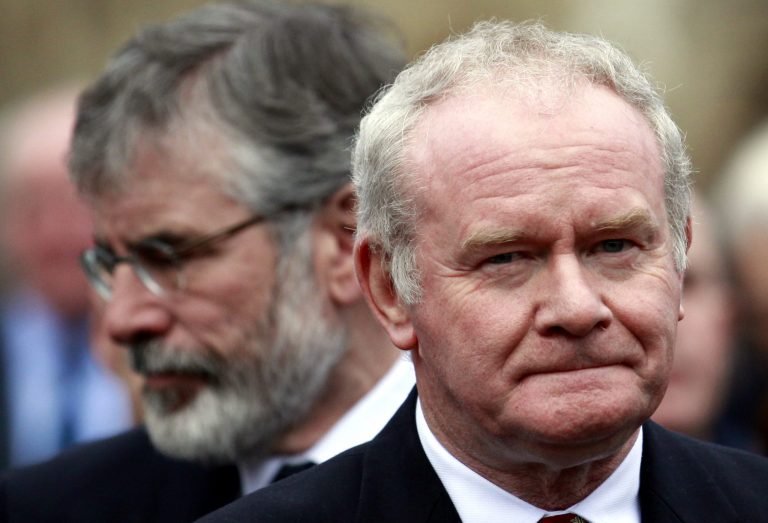 FILE - In this Wednesday, Nov. 27, 2013, file photo Sinn Fein's Martin McGuinness, right, and Gerry Adams attend the funeral of Catholic Priest Alec Reid Clonard Monastery, West Belfast, Northern  Ireland. Relations between Britain and Ireland have experienced many highs and lows in a century marked by rebellion, terror and treaties.  (AP Photo/Peter Morrison, File)