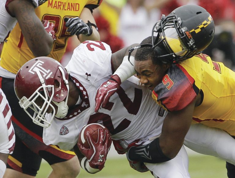 COLLEGE PARK, MD - SEPTEMBER 24:  Matt Brown #22 of the Temple Owls is tackled by Demetrius Hartsfield #9 of the Maryland Terrapins during the first half at Byrd Stadium on September 24, 2011 in College Park, Maryland.  (Photo by Rob Carr/Getty Images)
