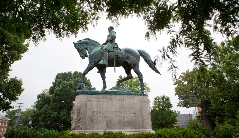 The Charlottesville City Council voted Tuesday night to cover two Confederate statues -- one of Lee and another of Stonewall Jackson -- with black fabric to signal the city's mourning over those killed during the events on Aug. 12. (AP Photo/Julia Rendleman, File)