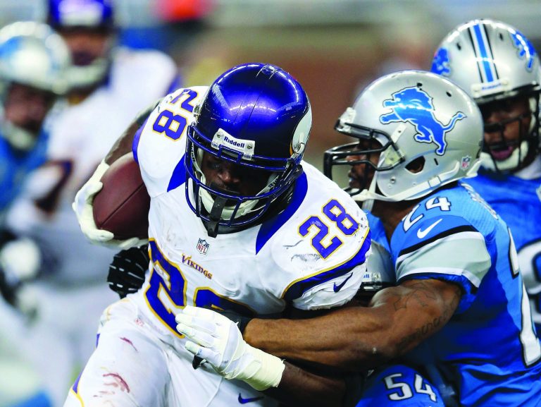 Leon Halip/Getty Images
Vikings running back Adrian Peterson ran for 102 yards on 21 carries against the Lions.