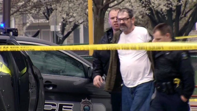 Frazier Glenn Cross, also known as Frazier Glenn Miller, is escorted by police in an elementary school parking lot in Overland Park, Kan. Cross, 73, accused of killing three people in attacks at a Jewish community center and Jewish retirement complex near Kansas City, is a known white supremacist and former Ku Klux Klan leader who was once the subject of a nationwide manhunt. (AP Photo/KCTV-5) MANDATORY CREDIT