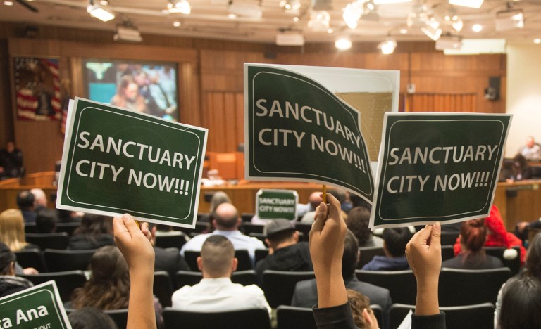 Students show their support for a proposed ordinance declaring a city a sanctuary for all residents regardless of immigration status. (Kevin Sullivan/The Orange County Register via AP)