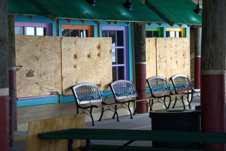 Boards were installed at businesses at The Boardwalk on Tuesday Oct. 9, 2018 on Okaloosa Island in Fort Walton Beach, Florida in preparation for Hurricane Michael. 