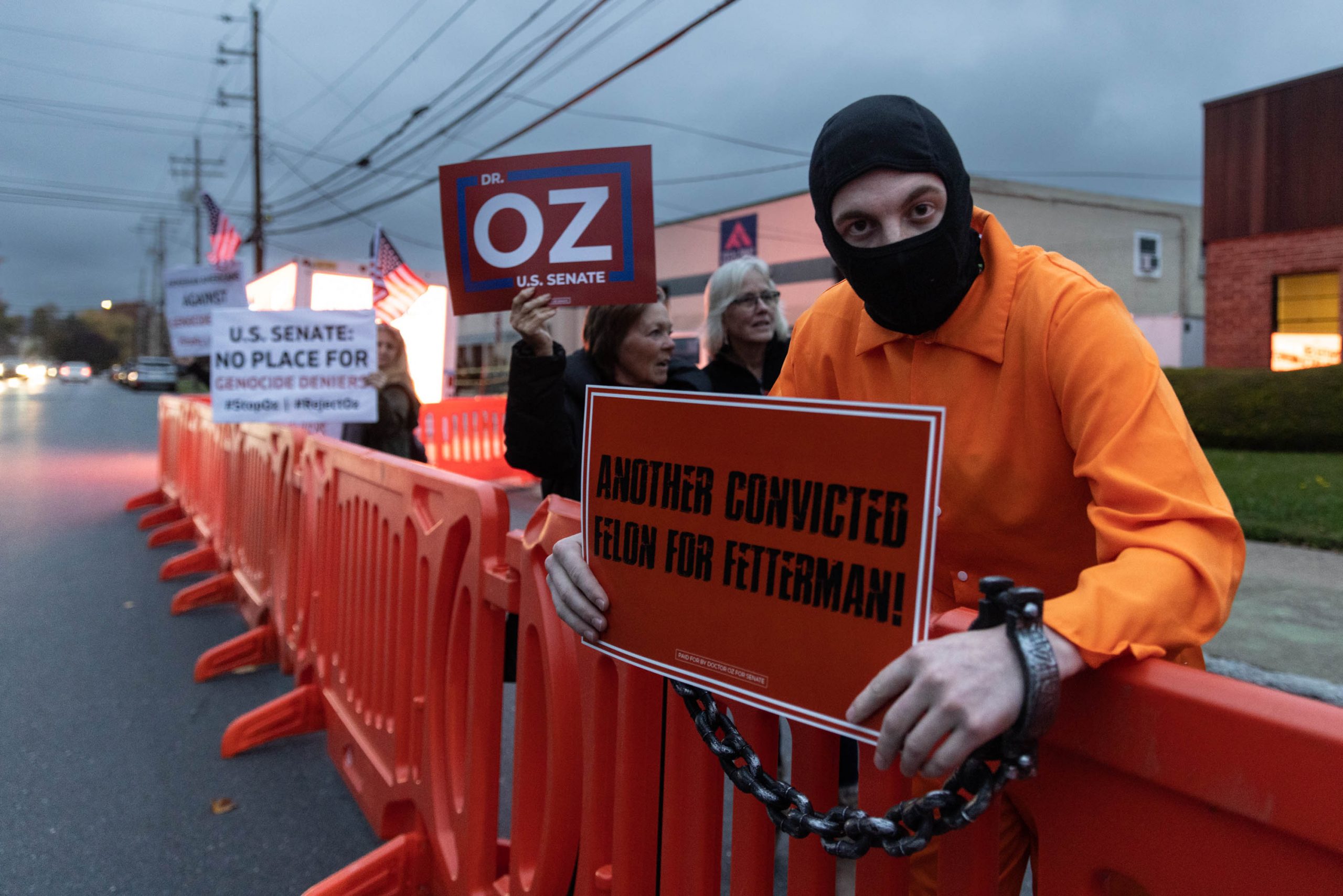 Protesters outside the senatorial debate night tent between Democratic candidate John Fetterman and Republican candidate Mehmet Oz, in Harrisburg, Pennsylvania, on Wednesday, Oct. 25, 2022.