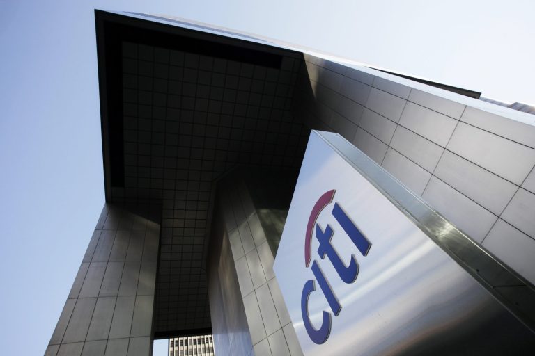 FILE - This Oct. 16, 2012 file photo shows the Citibank building in New York. Citigroup on Monday, July 14, 2014 said that its net income dropped in the second quarter after it took a $3.8 billion charge to settle claims over its risky subprime mortgage business. (AP Photo/Mark Lennihan, File)