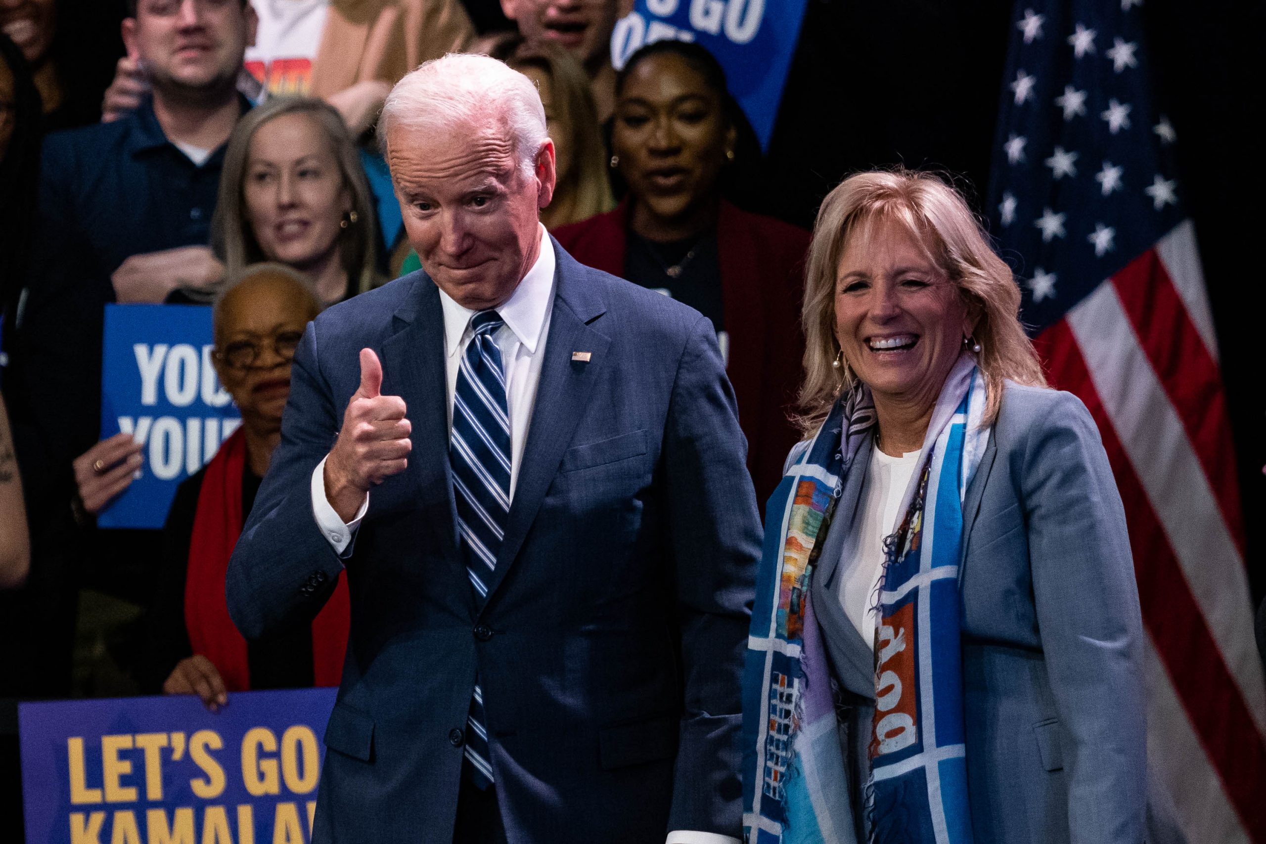 US President Joe Biden, alongside First Lady Jill Biden, gives a thumbs up a Democratic National Committee (DNC) rally at Howard Theater in Washington, DC, Thursday, November 10, 2022. Biden said his economic plan is showing results, citing promising data on inflation, two days after Democrats lodged a better-than-predicted showing in midterm elections.