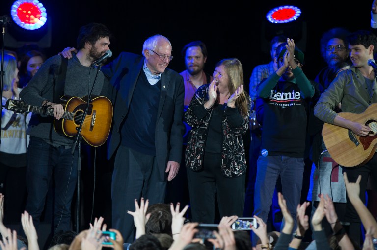 Bernie Sanders, second from left, and his wife Jane Sanders sing along to 