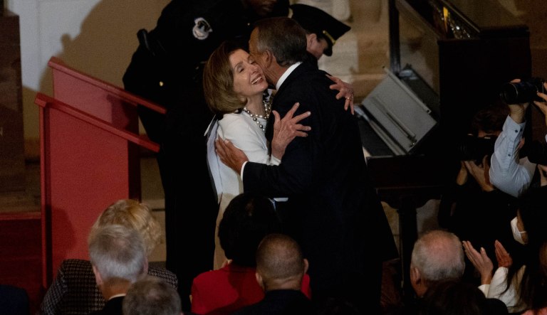 Former Speaker of the House John Boehner embraces Speaker Nancy Pelosi at her offical portrait unveiling at the U.S. Capitol Building on Wednesday, Dec. 14, 2022.