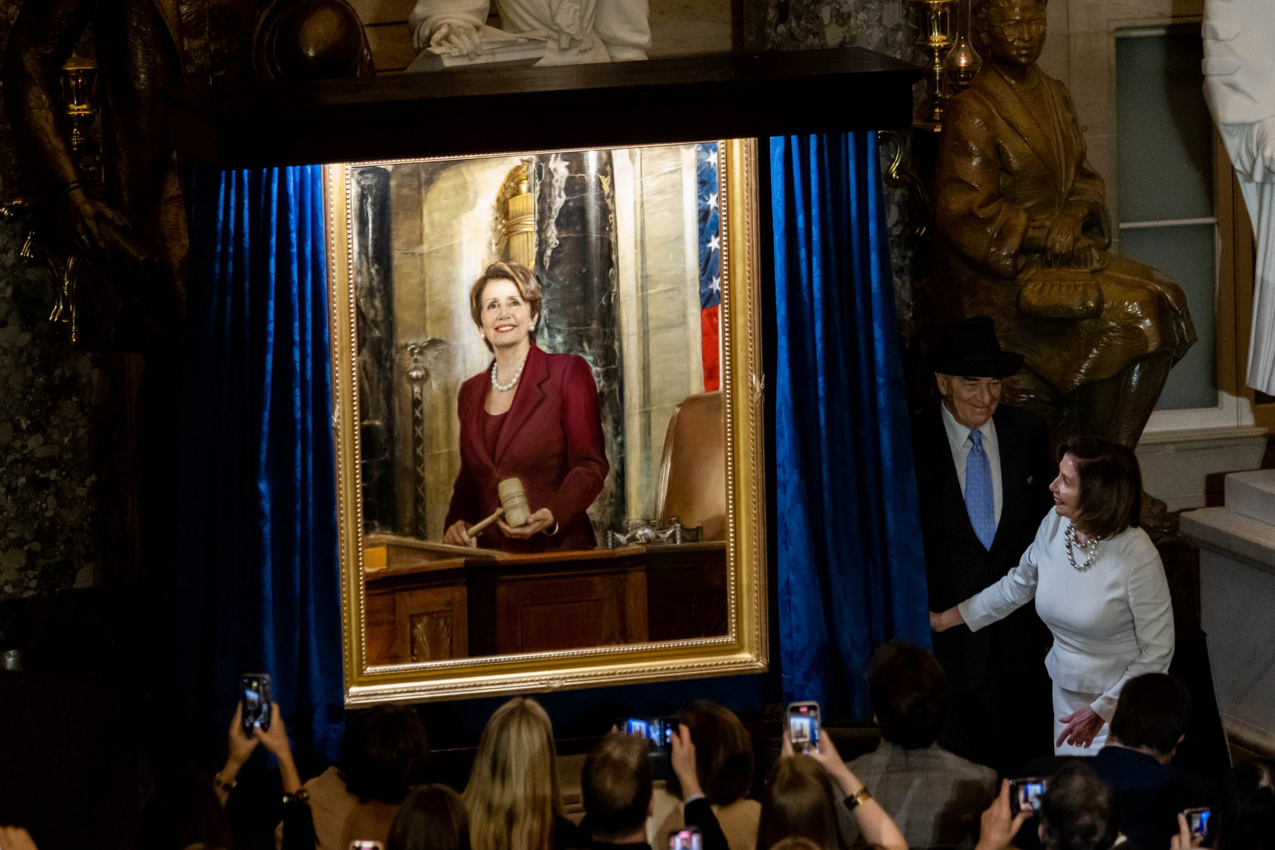 Speaker of the House Nancy Pelosi is joined by her husband Paul Pelosi as they attend her portrait unveiling ceremony in Statuary Hall at the Capitol in Washington, Wednesday, December, 14, 2022. 
